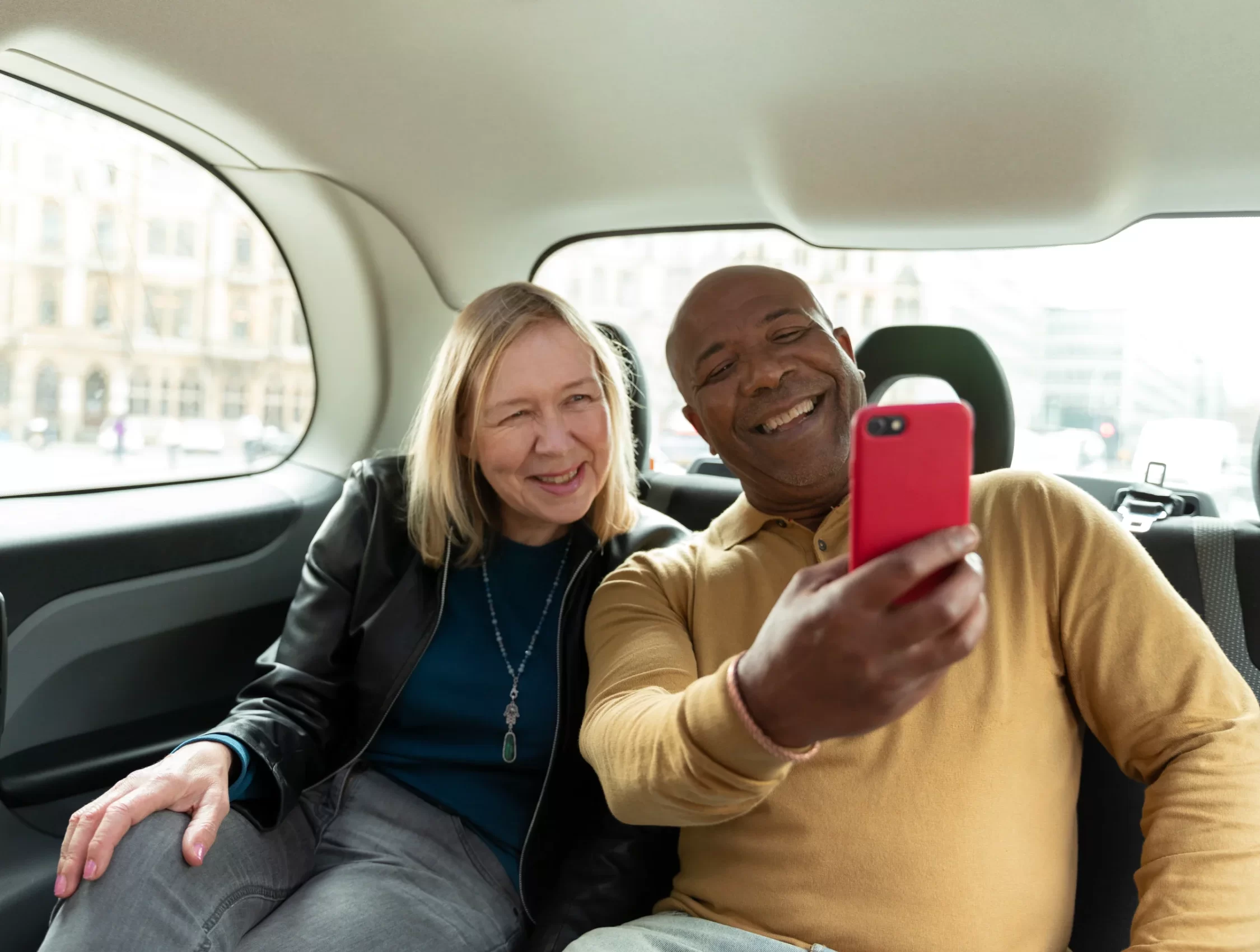 a couple smiling in a city to city ride